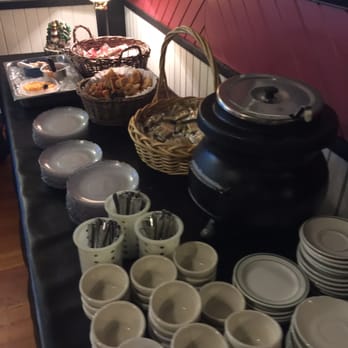 Big Frank's Resort - ows a table of dishes and cups - American Near Me - Fremont, Wisconsin