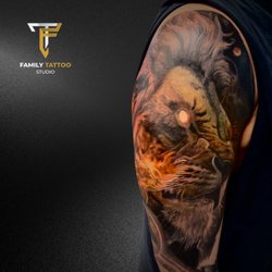 Family Tattoo Studio - The king of the jungle, forever fierce! This full-color lion tattoo is pure power.