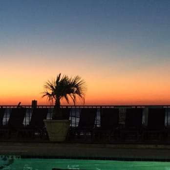 Compass Cove Resort - Great sunset if only the pool and chairs weren't in the way! - Resorts Near Me - Myrtle Beach, South Carolina Compass Cove Resort - Great sunset if only the pool and chairs weren't in the way! - Resorts Near Me - Myrtle Beach, South Carolina