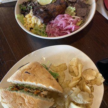 Modern Market Eatery - Blackened chicken Banh Mi (bottom) Baja Blackened chicken salad (top) - Breakfast & Brunch Near Me - Irving, Texas Modern Market Eatery - Blackened chicken Banh Mi (bottom) Baja Blackened chicken salad (top) - Breakfast & Brunch Near Me - Irving, Texas