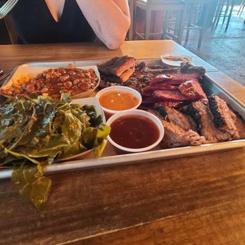 OAK'D BBQ - Braised Collard Greens Central Texas BBQ Beans ROSEWOOD WAGYU BRISKET OAK'D HOUSE WAGYU SAUSAGE LINK DUROC PORK SPARE RIBS - Barbeque Near Me - Dallas, Texas OAK'D BBQ - Braised Collard Greens Central Texas BBQ Beans ROSEWOOD WAGYU BRISKET OAK'D HOUSE WAGYU SAUSAGE LINK DUROC PORK SPARE RIBS - Barbeque Near Me - Dallas, Texas