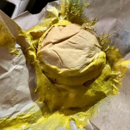 One of two in the Hamburger Combo, both drenched in mustard One of two in the Hamburger Combo, both drenched in mustard