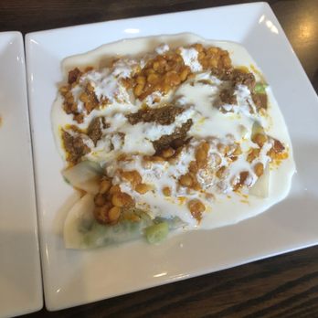 Maiwand Grill - Aushak (ravioli filled with scallions, served with garlic yogurt sauce, and topped with ground beef) - Afghan Near Me - Baltimore, Maryland Maiwand Grill - Aushak (ravioli filled with scallions, served with garlic yogurt sauce, and topped with ground beef) - Afghan Near Me - Baltimore, Maryland