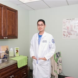 Edward Tjoe, DPM - Tjoe Podiatry - Dr. Tjoe in his office.