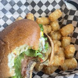 The Depot Gourmet Burgers - Bacon Cheeseburger missing a bite or two