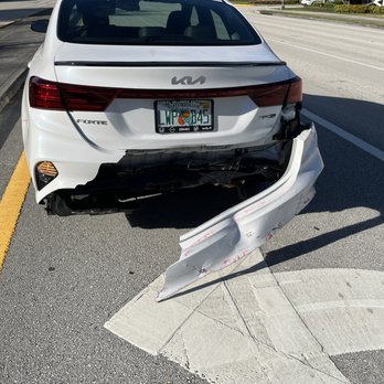 Auto Palace Collision - The entire bumper needs to be removed to fix the alignment. AP was paid $7500. It will cost $5500 to fix. - Body Shops Near Me - Delray Beach, Florida