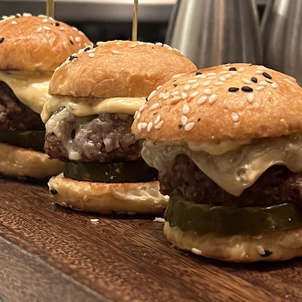 Lapidus Bar - three cheeseburgers with pickles - Cocktail Bars Near Me - Miami Beach, Florida Lapidus Bar - three cheeseburgers with pickles - Cocktail Bars Near Me - Miami Beach, Florida
