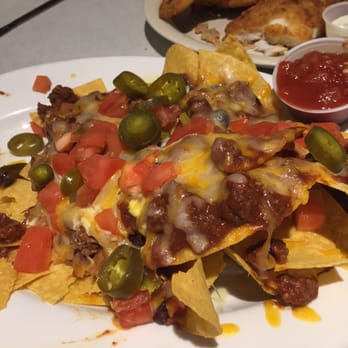 Parrot Island Grill - Nachos! Another great choice & jalapeños are super hot! - Seafood Near Me - Okeechobee, Florida Parrot Island Grill - Nachos! Another great choice & jalapeños are super hot! - Seafood Near Me - Okeechobee, Florida