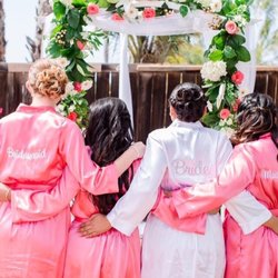Artistic Floral Design - Corral hypericum to accentuate the wedding arch
