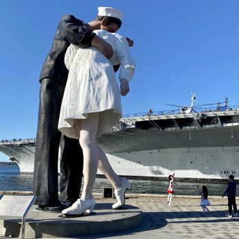 Embracing Peace - Children playing in the park around the Unconditional Surrender Statue - Landmarks & Historical Buildings Near Me - San Diego, California