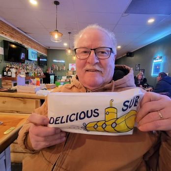 Lynn's 102 Tavern - a man holding a cup of delicious sushi - Pizza Near Me - Hudson, New Hampshire Lynn's 102 Tavern - a man holding a cup of delicious sushi - Pizza Near Me - Hudson, New Hampshire