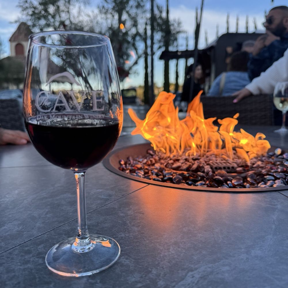 Oak Mountain Winery - Outside enjoying the fire place and a glass of wine. - Wineries Near Me - Temecula, California