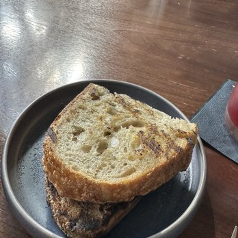 Arlo Grey by Kristen Kish - Sourdough bread- grilled, from 27 year old starter dough! - New American Near Me - Austin, Texas Arlo Grey by Kristen Kish - Sourdough bread- grilled, from 27 year old starter dough! - New American Near Me - Austin, Texas