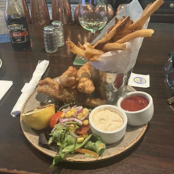 Dalton's Bar & Grill - Fish and chips with a spicy tartar sauce - New American Near Me - New York, New York Dalton's Bar & Grill - Fish and chips with a spicy tartar sauce - New American Near Me - New York, New York