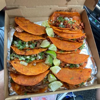 Juanita's Tacos - a man holding a box of tacos - Food Trucks Near Me - Summerfield, Florida Juanita's Tacos - a man holding a box of tacos - Food Trucks Near Me - Summerfield, Florida