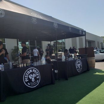 Piston Pete's - a group of people standing under a tent - Breweries Near Me - San Marcos, California
