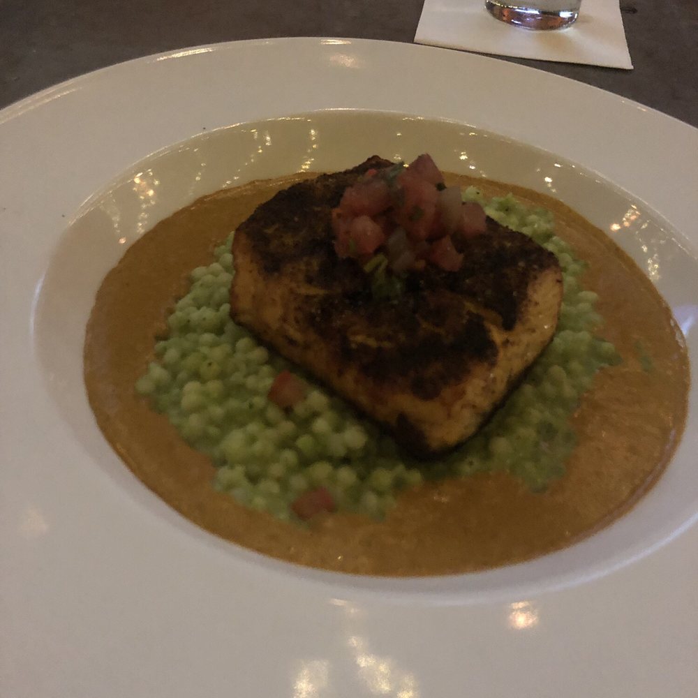 Zocalo - Grilled salmon with green chili goat cheese couscous and smoked pico cascabel cream. - New American Near Me - Charlottesville, Virginia Zocalo - Grilled salmon with green chili goat cheese couscous and smoked pico cascabel cream. - New American Near Me - Charlottesville, Virginia
