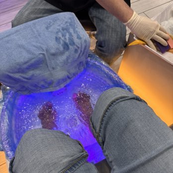 Organic Nail Bar - Pedicure in progress. Disposable liners and gloves in use for hygiene and safety. - Nail Salons Near Me - Grand Prairie, Texas
