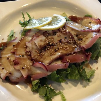 Kai's Sushi & Grill - Baby octopus salad, thin slices of squid garnished with sesame seeds, greens and a sweat sauce. - Sushi Bars Near Me - Minnetonka, Minnesota