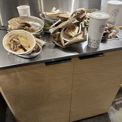 The overflowing trash receptacle