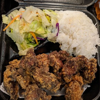 Yogis Grill - my Karaage plate .. It looks oddly blackish w/very little batter- zero dressing as well Disappointing :( - Japanese Near Me - Mesa, Arizona Yogis Grill - my Karaage plate .. It looks oddly blackish w/very little batter- zero dressing as well Disappointing :( - Japanese Near Me - Mesa, Arizona
