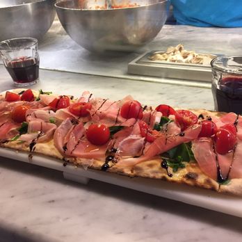 Mangia Pizza - This is the pizza we had with some house wine. You can see the chef working in the background. - Pizza Near Me - Florence, FI