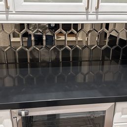 Black countertop & backsplash by Nulook