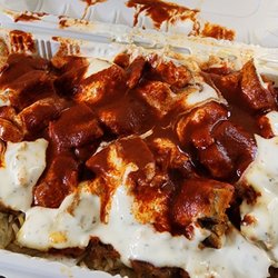 Hamza & Madina - Lamb over rice, hot sauce is legit hot coming from an Indian person, however white sauce is tart and meat flaverless.
