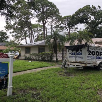 Duralast Roofing and Solar - The workers installing new roof.  I was here to plan the landscaping we would install to help the sellers spruce up. - Roofing Near Me - Largo, Florida