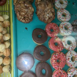 a variety of doughnuts on a tray