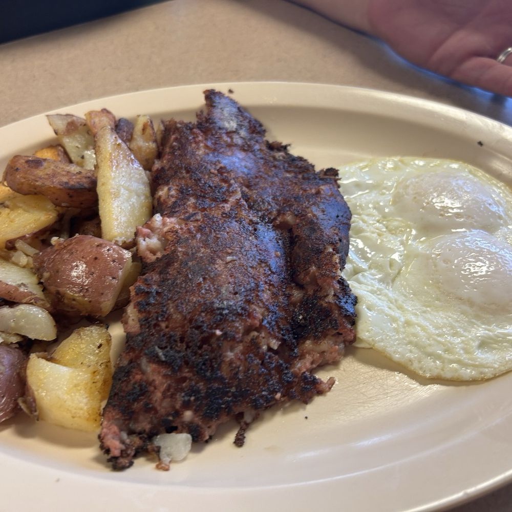 My friend's Corn Beef Hash and 2 Eggs - perfectly cooked. My friend's Corn Beef Hash and 2 Eggs - perfectly cooked.