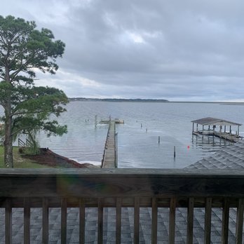 Beach Realty & Construciton - Stagnant water and rotting bay grass. - Real Estate Services Near Me - Kitty Hawk, North Carolina