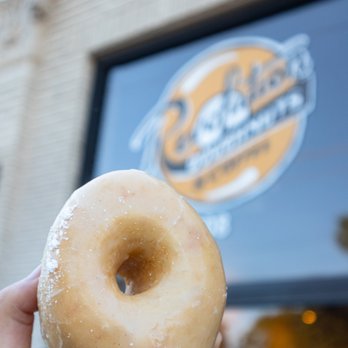 Revolution Doughnuts - a hand holding a doughnut - Donuts Near Me - Decatur, Georgia Revolution Doughnuts - a hand holding a doughnut - Donuts Near Me - Decatur, Georgia