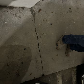Reyes Contracting - a person standing on a concrete wall - General Contractors Near Me Reyes Contracting - a person standing on a concrete wall - General Contractors Near Me