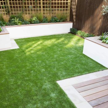 Elite Home Solutions - a modern garden with artificial grass - Plumbing Near Me Elite Home Solutions - a modern garden with artificial grass - Plumbing Near Me