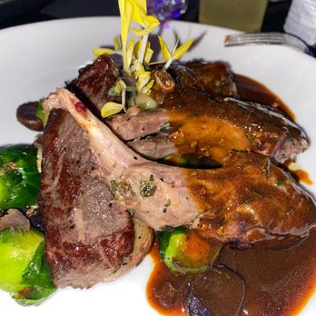 Deluxe Fun Dining - Ribeye with lam chops potatoes and Brussels sprouts - Bars Near Me - Charlotte, North Carolina Deluxe Fun Dining - Ribeye with lam chops potatoes and Brussels sprouts - Bars Near Me - Charlotte, North Carolina