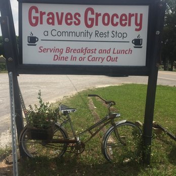 Graves Grocery - a bicycle parked next to a sign - Grocery Near Me - Laceys Spring, Alabama