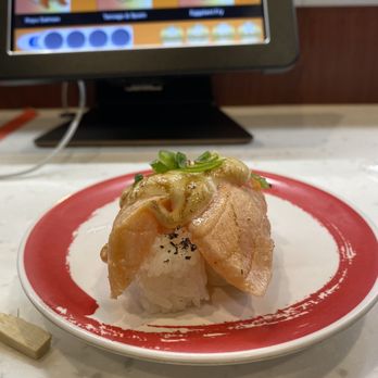 Genki Sushi - Garlic salmon nigiri - Sushi Bars Near Me - Kapolei, Hawaii Genki Sushi - Garlic salmon nigiri - Sushi Bars Near Me - Kapolei, Hawaii