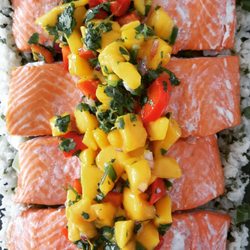 Salmon over cauliflower coconut-cilantro rice topped with mango salsa