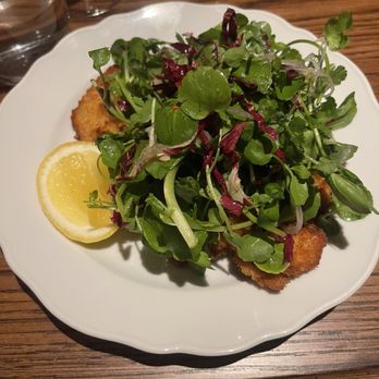 Little Sparrow - Schnitzel buried under a delicious salad - French Near Me - Atlanta, Georgia Little Sparrow - Schnitzel buried under a delicious salad - French Near Me - Atlanta, Georgia
