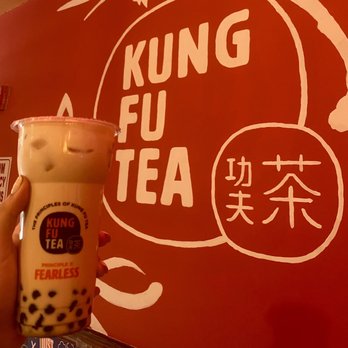 Kung Fu Tea - a hand holding a cup of tea - Bubble Tea Near Me - Champaign, Illinois