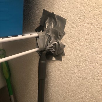Brady Realty Group - Broken closet 4- currently using duct tape and a broom to hold it up so we could store stuff on top. - Real Estate Services Near Me - Las Vegas, Nevada