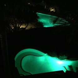 Peppers Salt Resort & Spa - The Tropical pool and a private plunge pool lit up at night.