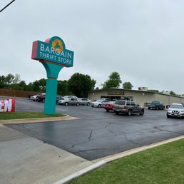 Exterior outside entrance of Bargain Thrift Store - Our pole sign and parking lot on NW 16th St. Open 7 days a week. - Oklahoma City, Oklahoma Exterior outside entrance of Bargain Thrift Store - Our pole sign and parking lot on NW 16th St. Open 7 days a week. - Oklahoma City, Oklahoma