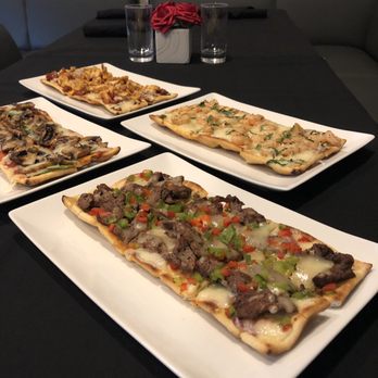 Madisons Restaurant and Bar - Flat breads for happy hour - steak, veggie, shrimp or chicken bacon - New American Near Me - Miami, Florida Madisons Restaurant and Bar - Flat breads for happy hour - steak, veggie, shrimp or chicken bacon - New American Near Me - Miami, Florida