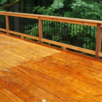Willie Home Improvement - a wooden deck with black iron railings - General Contractors Near Me - Annapolis, Maryland Willie Home Improvement - a wooden deck with black iron railings - General Contractors Near Me - Annapolis, Maryland