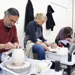 Northern Clay Center - Adult students working on the pottery wheel.