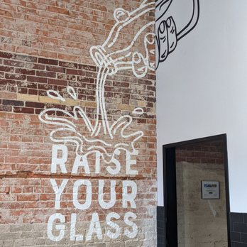 Milk Bottle Cookies - raise your glass sign on a brick wall - Bakeries Near Me - Waco, Texas Milk Bottle Cookies - raise your glass sign on a brick wall - Bakeries Near Me - Waco, Texas