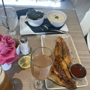 Dawn AM Eatery - Mimosa, Jalapeno cheddar grits, greens, and The Fish Fry (one fried, one blackened) - Southern Near Me - Chicago, Illinois