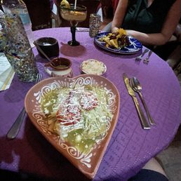 Queso Enchiladas with verde sauce, rice and beans